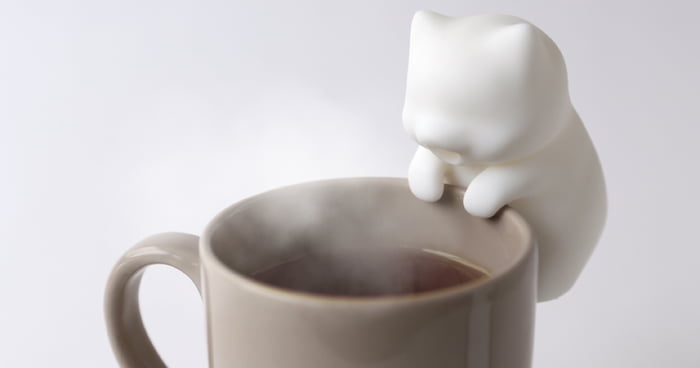 This Cute Little Cat Robot Blows On Hot Food & Drinks To Cool Them Down